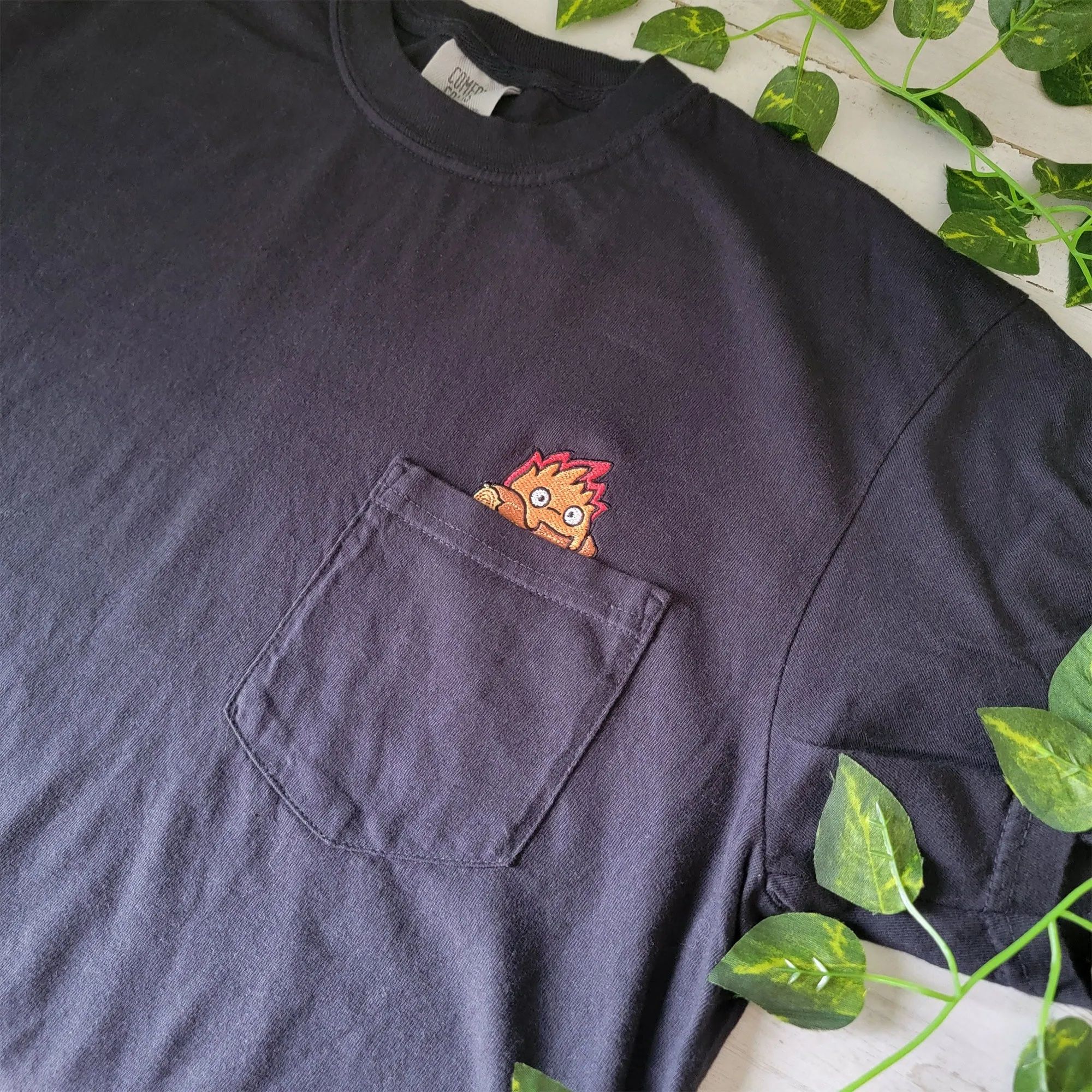 Calcifer Yule Log Pocket Tee