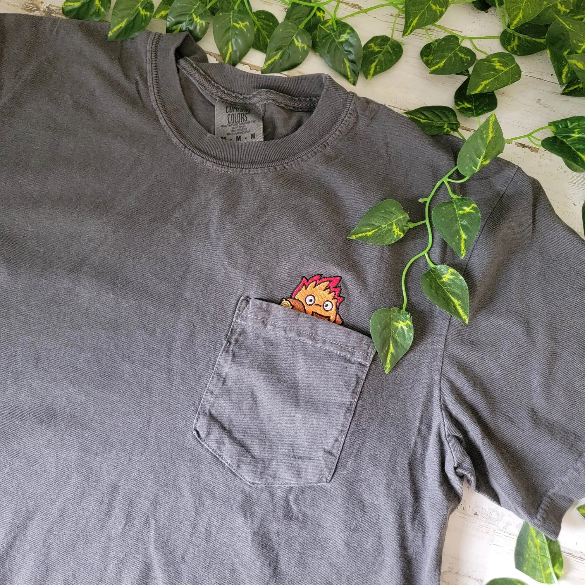 Calcifer Yule Log Pocket Tee